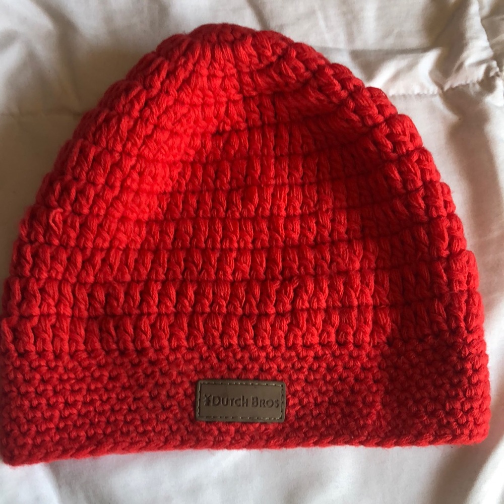 Dutch Bros red crocheted beanie with brown leather logo tag on front